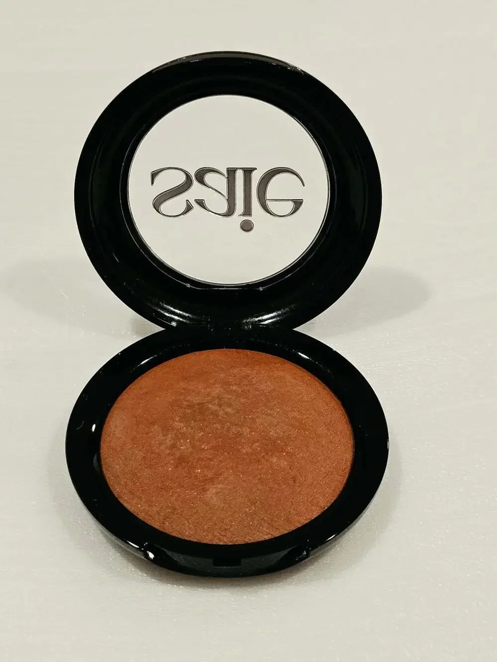 Saie brand SUPERSUEDE™ Radiant Baked Bronzer in the shade Bari